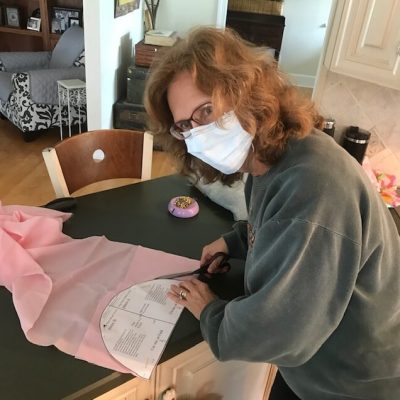 Cindy Chitty and Peggy Morey making protective head coverings for hospital staff in San Diego.